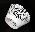 Elegant white laser-cut cupcake wrappers with intricate floral vine patterns - White