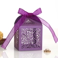 Close-up of purple laser-cut gift box with intricate swirl pattern and organza ribbon - Dark Purple