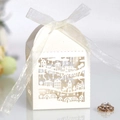 Detail of white house-shaped laser cut favor box with THANK YOU text and organza ribbon - Ivory
