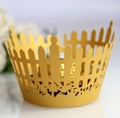 Close-up of golden laser-cut cupcake wrappers with fence and floral hollow patterns - 5cm / Gold