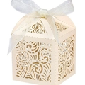 Detail of laser-cut off-white wedding favor box with swirl pattern and white ribbon bow - Ivory Star With Ivory Ribbon