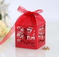 Macro detail of red laser-cut candy box with city silhouette and Thank You text - Pearlescent Red