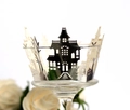 Silver laser-cut Halloween cupcake wrappers featuring haunted house and pumpkin silhouettes - Reflective Silver