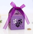 Close-up of laser-cut purple gift box with LOVE heart pattern and matching organza ribbon - Dark Purple