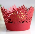 Detail of red laser-cut cupcake liner with intricate floral hollow design and candy - 5cm / Pearlescent Red