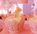 Intricate laser-cut cake wrappers in light pink with elegant feather pattern and bird toppers - Pink