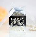 Detailed view of silver hollow laser-cut gift box with a light blue satin ribbon bow - Reflective Silver