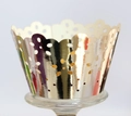 Close-up of laser-cut cupcake wrappers with golden floral patterns and wavy edges - Reflective Silver