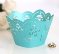 Detail of Tiffany blue laser-cut cupcake wrapper with elegant floral lace pattern - Teal Blue