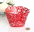 Elegant laser-cut red lace cupcake wrappers with intricate floral patterns for party decor - Pearlescent Red
