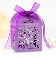 Detailed laser-cut filigree pattern on a purple wedding candy box with silk ribbon bow - Deep purple