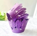 Detail of purple laser-cut cupcake wrappers with elegant feather hollow pattern for weddings - Dark Purple