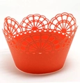 Detail of laser-cut orange cupcake wrapper with intricate floral hollow patterns - 5cm / Orange Red