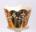 Macro view of laser-cut gold cupcake wrappers with intricate heart and floral patterns - Reflective Gold