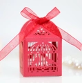 Macro detail of red laser-cut birdcage candy box with elegant organza ribbon bow - Pearlescent Red