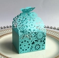 Teal laser-cut wedding favor box with floral hollow patterns and butterfly closure - Tiffany Blue