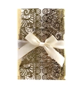 Detailed laser-cut lace pattern on gold wedding invitation with white silk ribbon bow - Reflective Gold