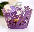 Detail of laser cut purple butterfly cupcake wrapper with intricate floral hollow design - 5cm / Dark Purple