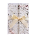 Elegant laser-cut wedding invitation with white lace pattern and a yellow satin ribbon bow - White