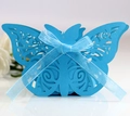 Macro detail of a laser-cut butterfly wedding favor box with a blue silk ribbon - Sky Blue