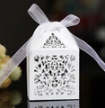 Laser cut white paper gift box with floral hollow patterns and white ribbon bow - White