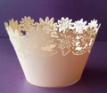Detailed laser-cut cream cupcake wrapper featuring an intricate sunflower pattern edge - Jade Pearl