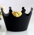 Detail shot of a matte black crown-shaped cupcake liner holding a chocolate truffle - Black Khaki