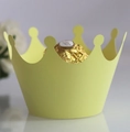 Close-up of laser-cut crown cupcake wrappers in vibrant yellow for party dessert display - Lemon Yellow