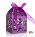 Detail of purple laser cut gift box featuring intricate European patterns and silk ribbon - Dark Purple