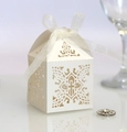Close-up of laser-cut cross pattern on ivory wedding candy box with organza ribbon - Ivory
