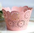 Macro view of pink laser-cut cupcake wrapper with sunflower and dot patterns - 5*5*8CM / Pink