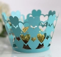 Detail of sky blue laser-cut cupcake wrapper with hollow heart lace pattern and gold chocolate - 5cm / Tiffany Blue