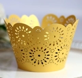 Detail of golden laser-cut cupcake wrappers with intricate floral hollow patterns - 5*5*8CM / Gold