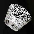 Macro view of white laser-cut vine and leaf patterns on cupcake paper wrapper - 5cm / White