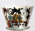 Macro shot of silver laser-cut cupcake wrapper with intricate patterns for wedding decor - Silver