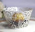 Elegant white laser-cut cupcake wrapper with vine patterns and gold chocolate display - White