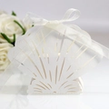 Elegant shell-shaped laser-cut white favor box with pearl finish and white ribbon bow - Ivory