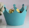 Macro shot of blue pearlescent crown cupcake wrappers for elegant party table decor - Tiffany Blue