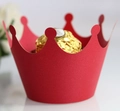 Detail of red crown shaped paper cupcake liner holding a chocolate on white background - Pearlescent Red