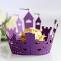 Detail of laser-cut purple cupcake wrapper with castle pattern and hollow heart designs - Dark Purple