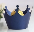 Macro view of dark blue crown-shaped cupcake wrappers with pearlescent paper texture - Magic Blue