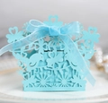 Close-up of laser-cut love bird candy box in light blue with elegant ribbon bow - Tiffany Blue