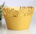 Golden laser-cut cupcake liners with star and wave patterns for party cake decoration - Gold