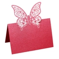 Dettaglio del segnaposto a farfalla tagliato al laser con glitter rosa e cuori - Rosso Perlato