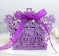 Detail of purple laser-cut gift box with floral bird patterns and silk ribbon bow - Dark Purple