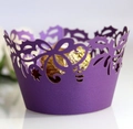 Detailed macro view of a purple laser-cut cupcake wrapper with elegant floral patterns - Dark Purple