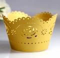 Macro shot of laser-cut gold rose cupcake wrappers with pearlescent finish and shimmer - Golden Yellow (5cm)