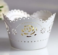 Macro detail of laser-cut gold rose pattern on white muffin cupcake wrappers - White (5cm)