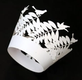 Detail of white laser cut bird and leaf lace cupcake wrapper on a black background - 5cm / White