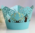Close-up of Tiffany blue laser-cut butterfly cupcake wrapper with intricate lace detail - Tiffany Blue